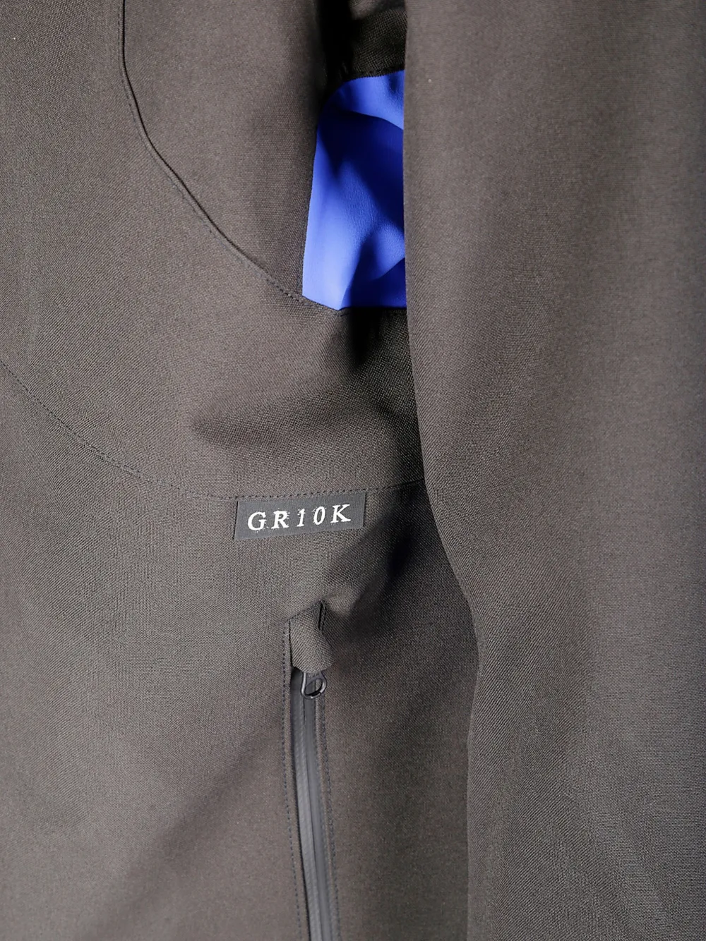 Gr10k Waterproof Jacket With Contrasting Elastic Accents In Gray