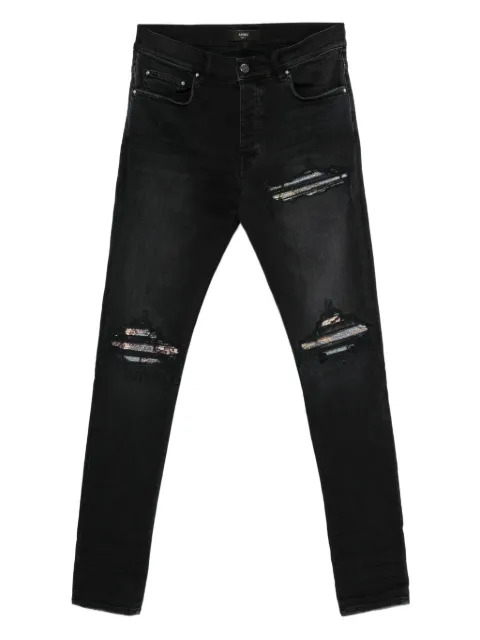 AMIRI jeans con diseño patchwork y efecto envejecido