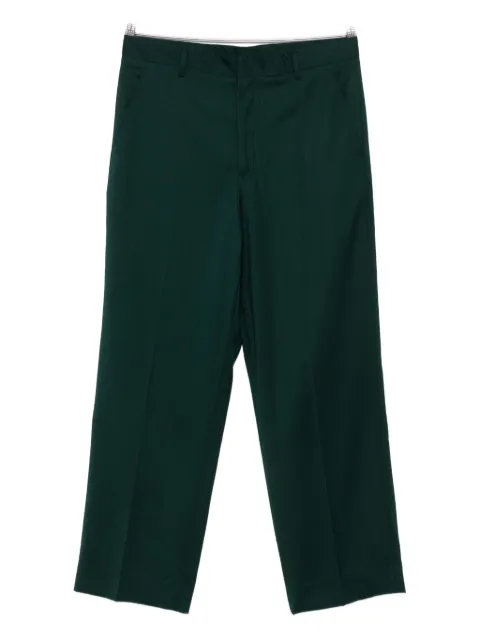 Costumein concealed-fastening trousers