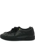 Louis Vuitton Pre-Owned monogram embossed-logo sneakers - Black