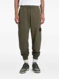 Stone Island logo-patch cuffed track pants - Green