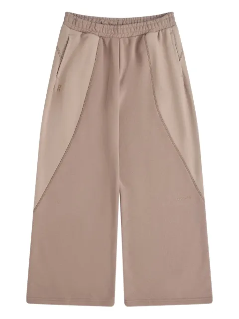 On Running pantalones a paneles
