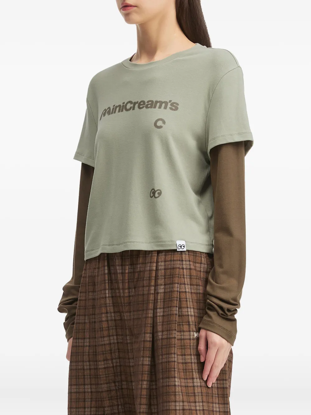 Mini Cream Layered Graphic Top In Green