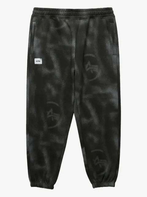 Alpha Industries pants con estampado tie-dye y logo