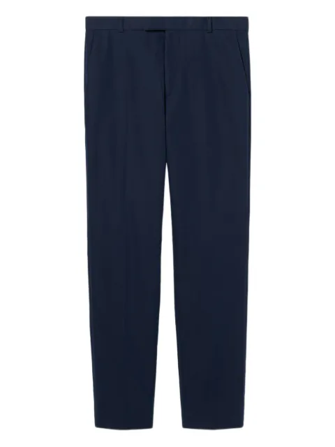 Gucci embossed-logo twill trousers