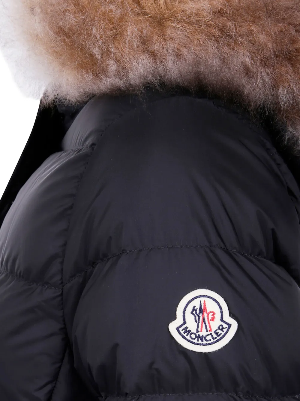 Moncler Gewatteerde jas met afwerking van bont Zwart