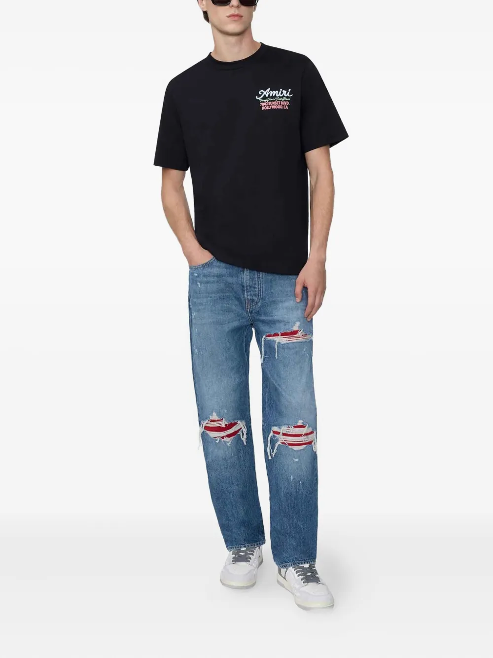 AMIRI distressed ripped-knees denim jeans - Blauw