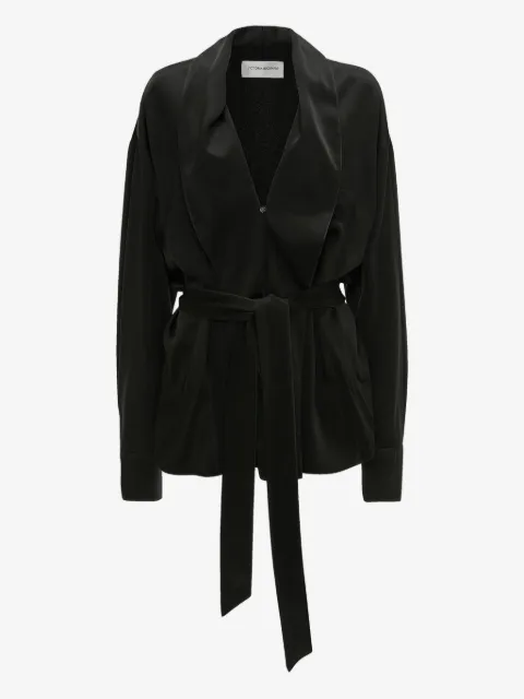 Victoria Beckham blusa con cinturón cruzado