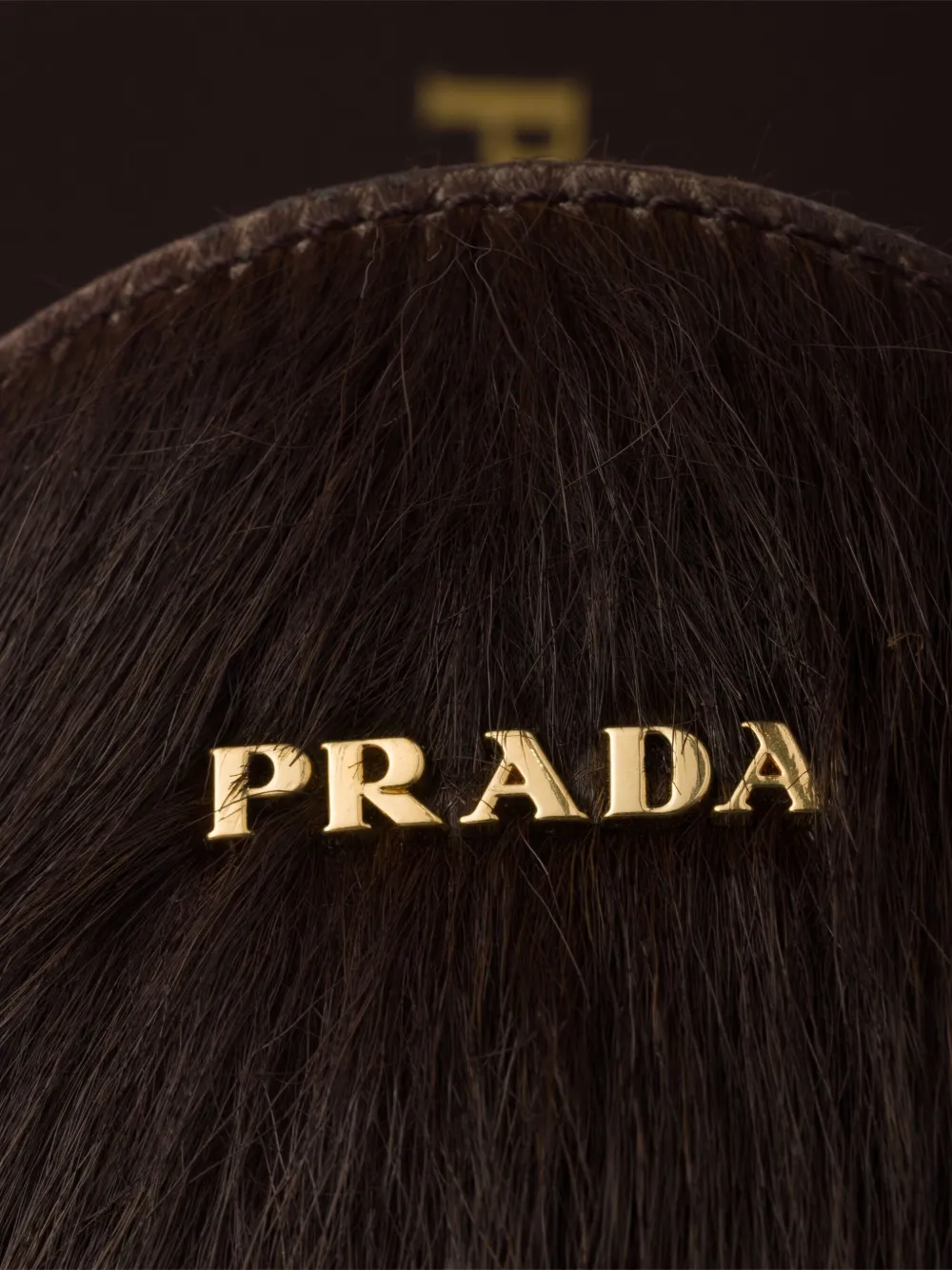 Prada Muiltjes met logoplakkaat en kalfshaar Bruin