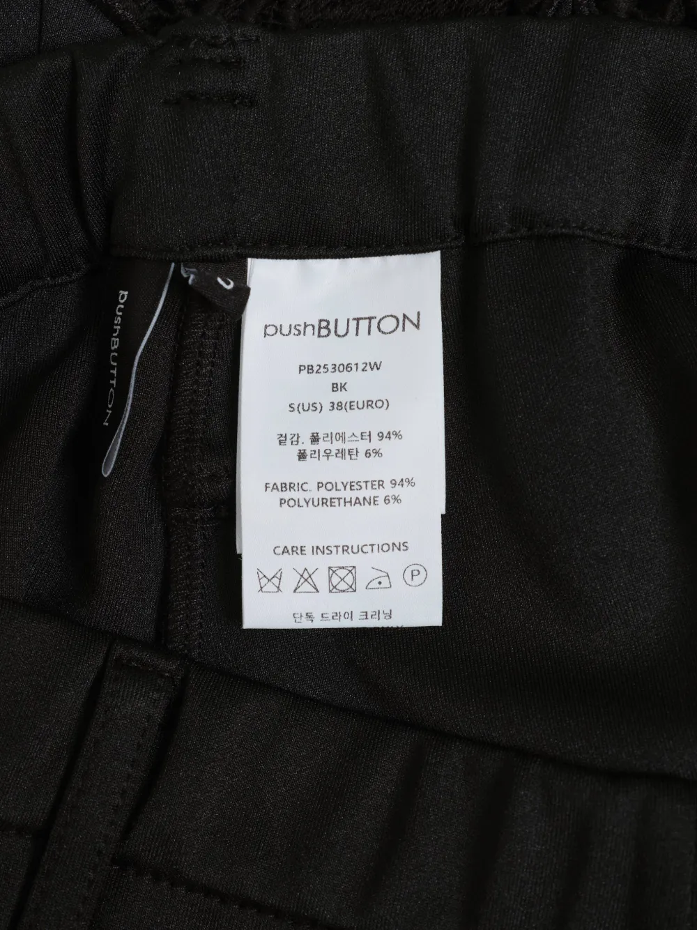 Pushbutton Lace-hem Flared Trousers In Black
