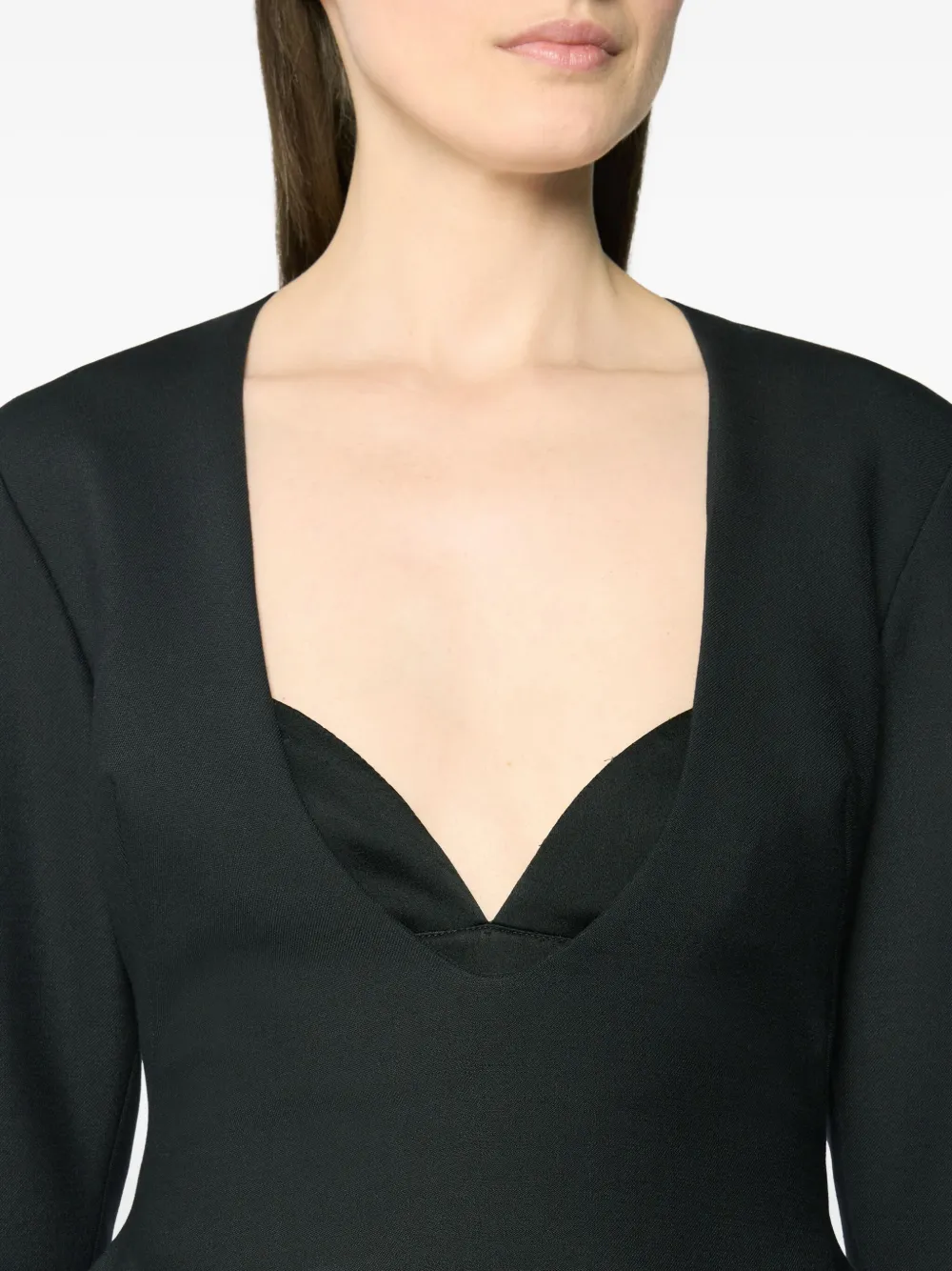 Genny Peplum Top In Black