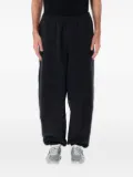 Nike swoosh-embellished track pants - Black