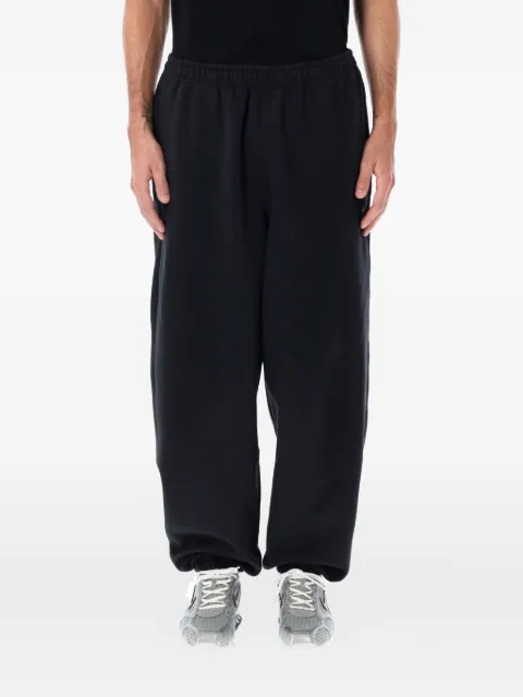 Nike pants con detalles Swoosh