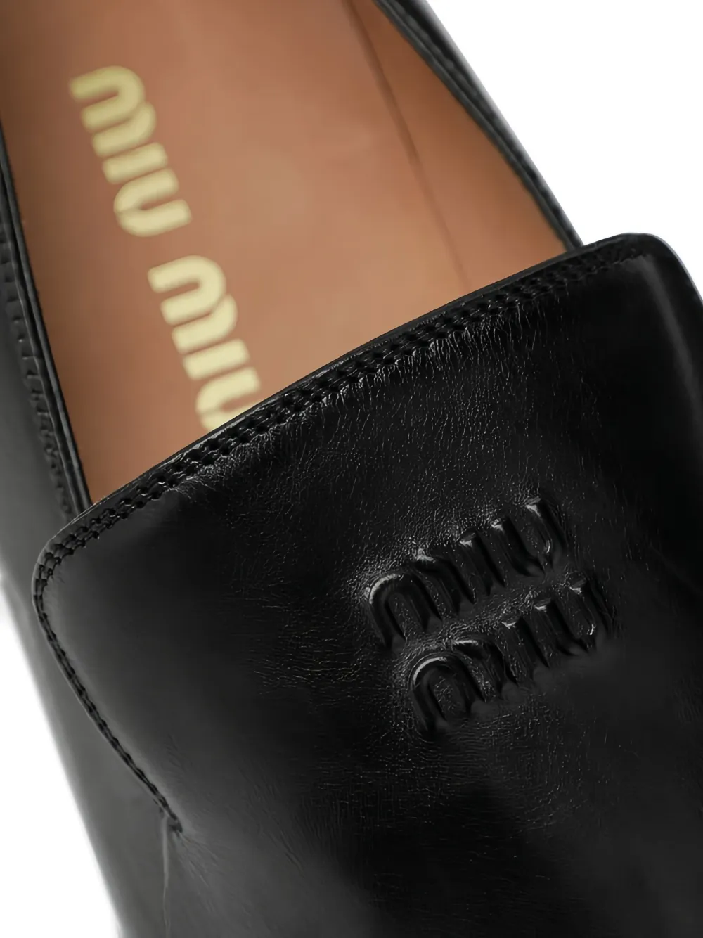 Miu Loafers met reliëf Zwart