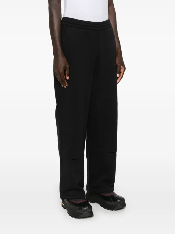 Carhartt WIP logo-patch Track Pants | Black | FARFETCH NZ