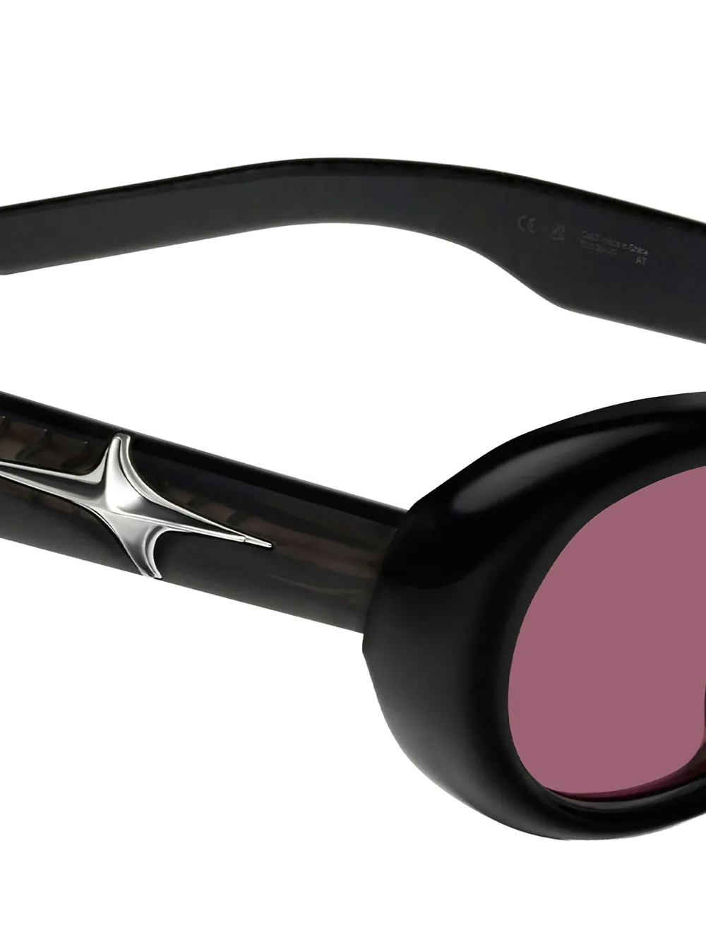 Gentle Monster Loco 01(R) zonnebril met ovalen montuur en sterdetail Zwart