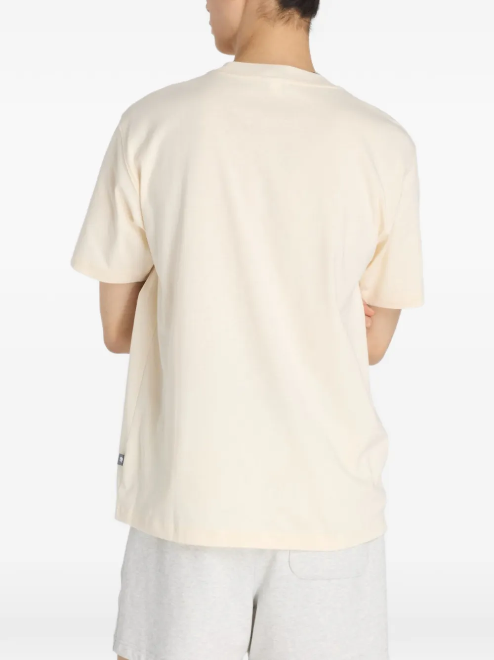 New Balance T-shirt met grafische print Beige