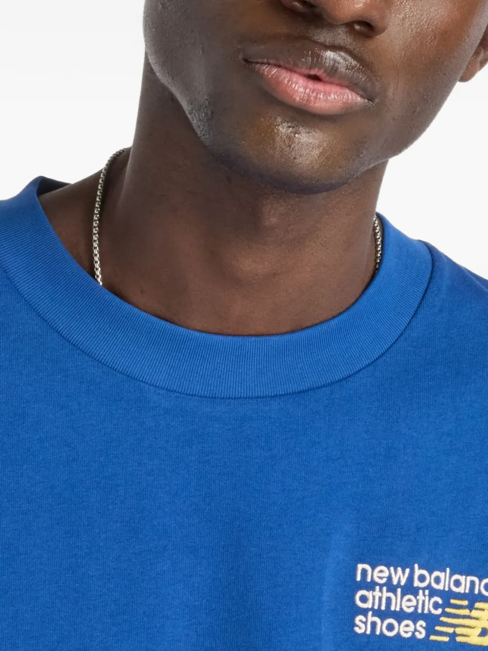 New Balance T-shirt met geborduurd logo Blauw