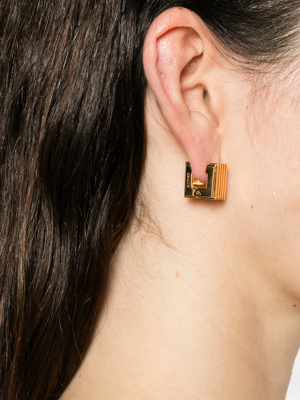 KHAITE small Empire engraved logo earrings - Goud