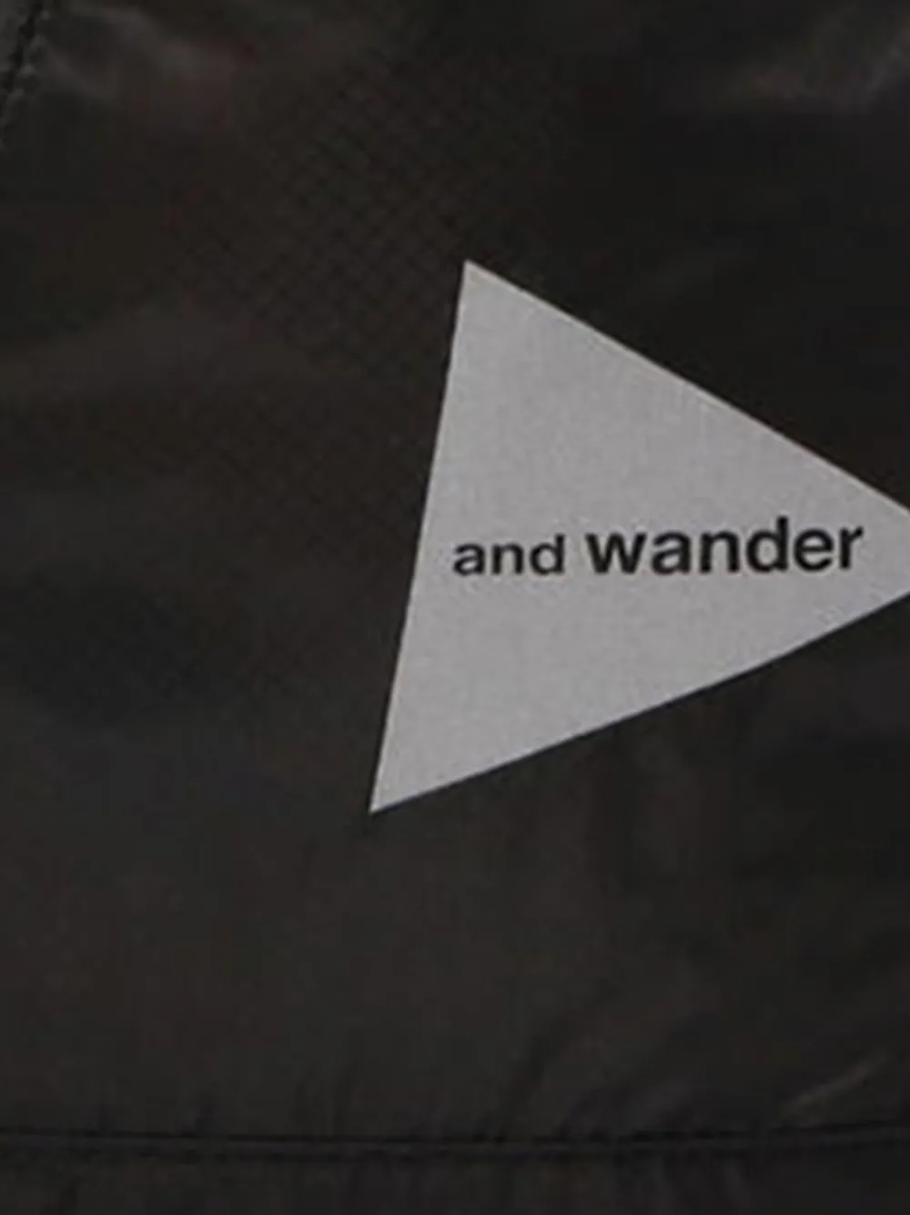 And Wander Drawstring Zip Backpack In Black