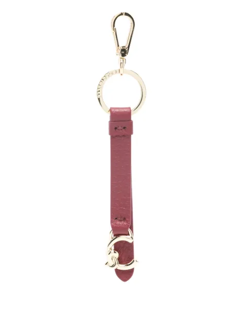Coccinelle llavero con dije del logo