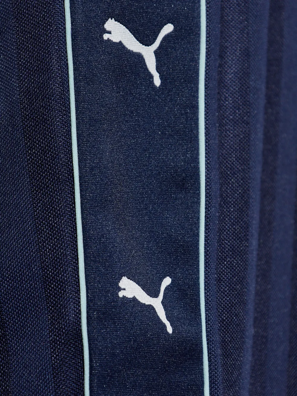 PUMA x Guizio gestreepte broek met logoprint Blauw