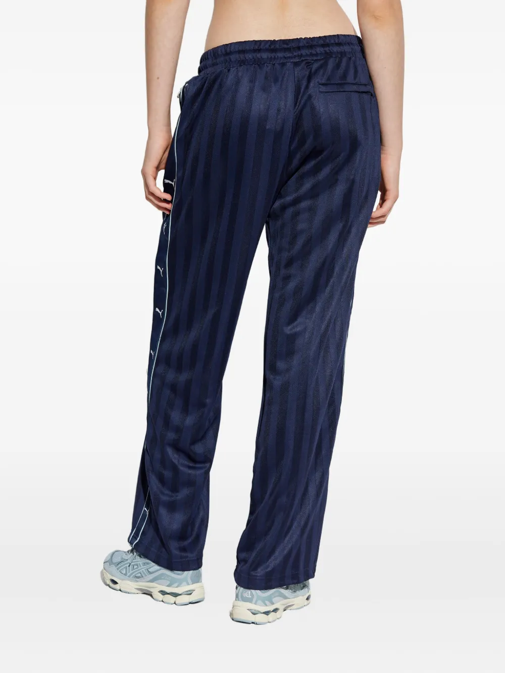 PUMA x Guizio gestreepte broek met logoprint Blauw