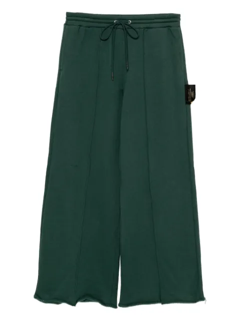 Undercover slogan-patch trousers