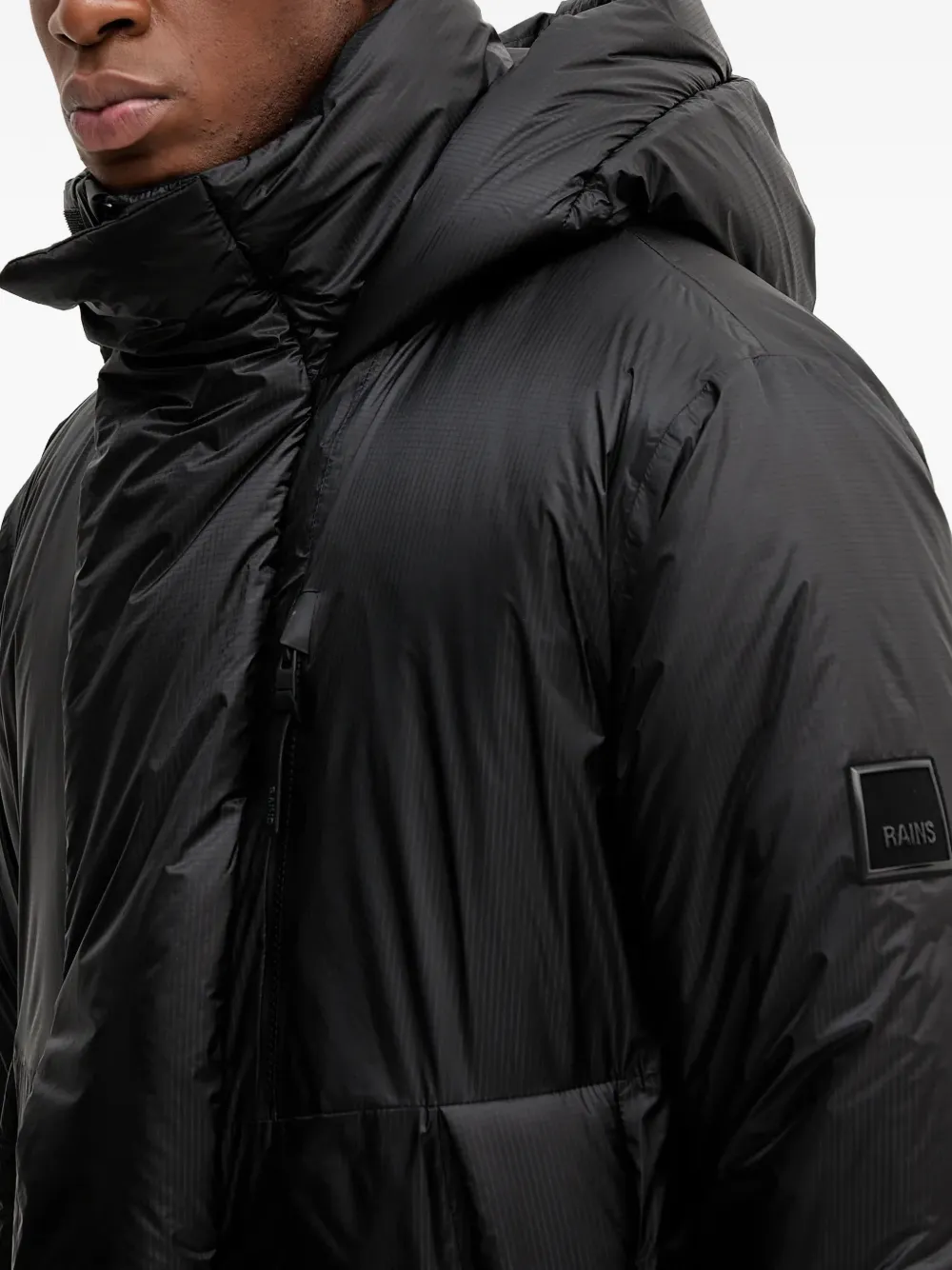 Rains 17240 Torna Insulated jack met capuchon en vlakken Zwart