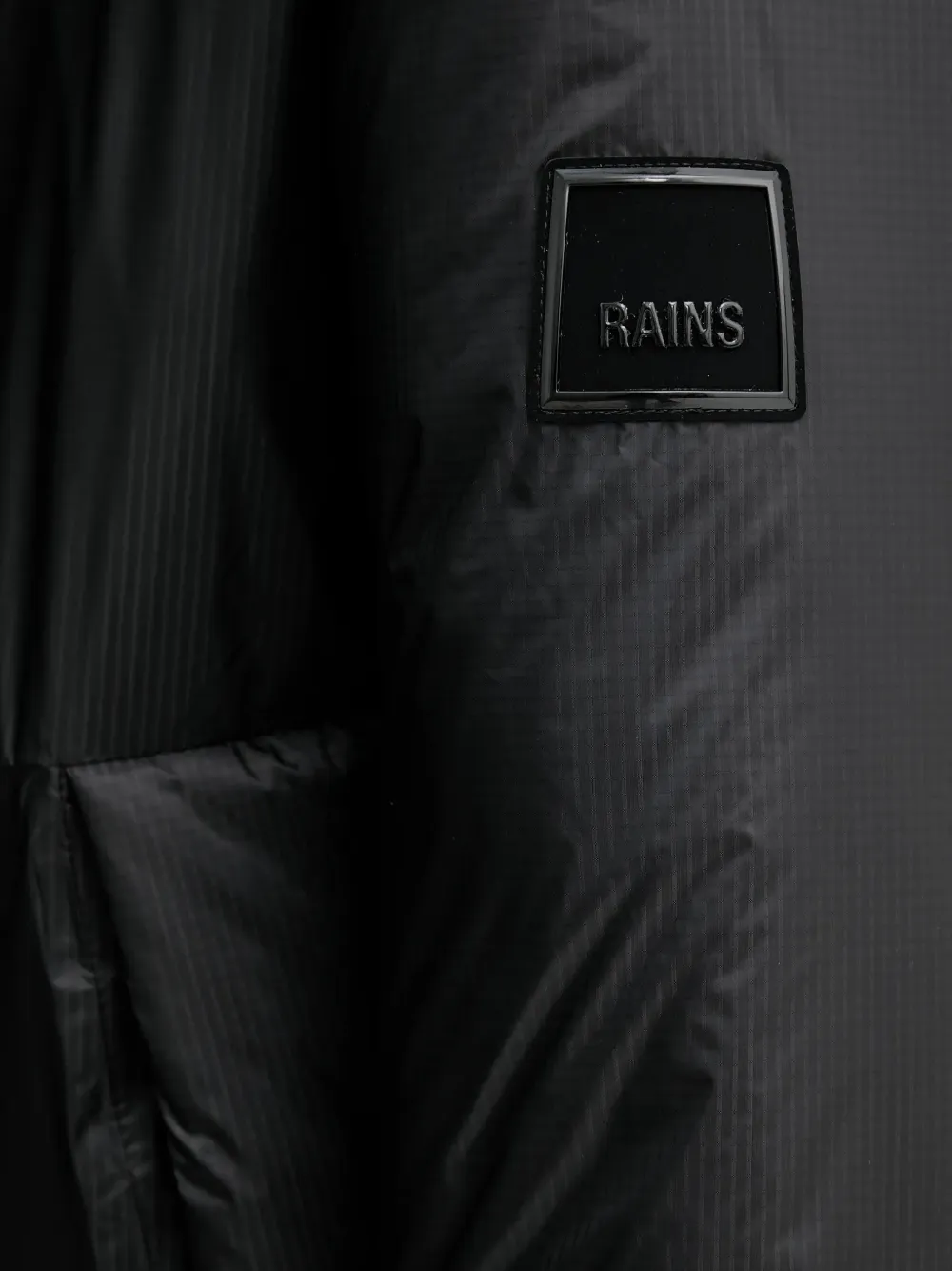 Rains 17240 Torna Insulated jack met capuchon en vlakken Zwart