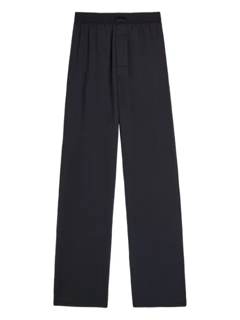 Skims pleat-detailing trousers