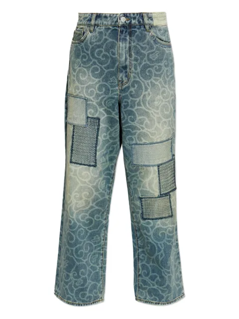 A BATHING APE® abstract-pattern patchwork jeans