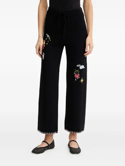 NEVER FULLY DRESSED embroidered track pants