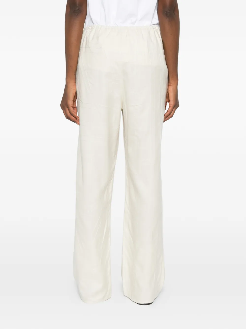 TOTEME Broek met monogram-print Beige