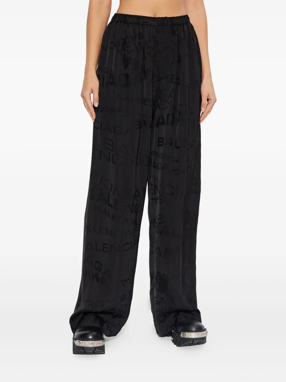 Balenciaga Flared broek met logo Zwart