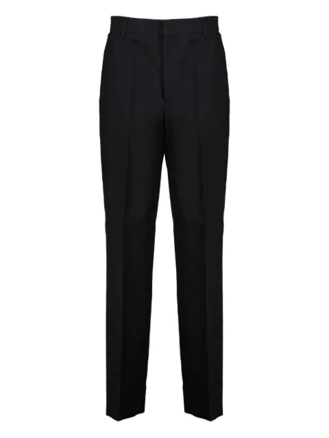 Moschino logo-trim trousers