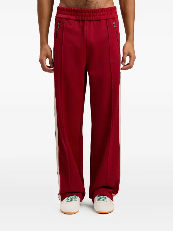 Palm Angels レッド トラックパンツ Palm Angels サイドストライプ トラックパンツ | レッド | FARFETCH JP