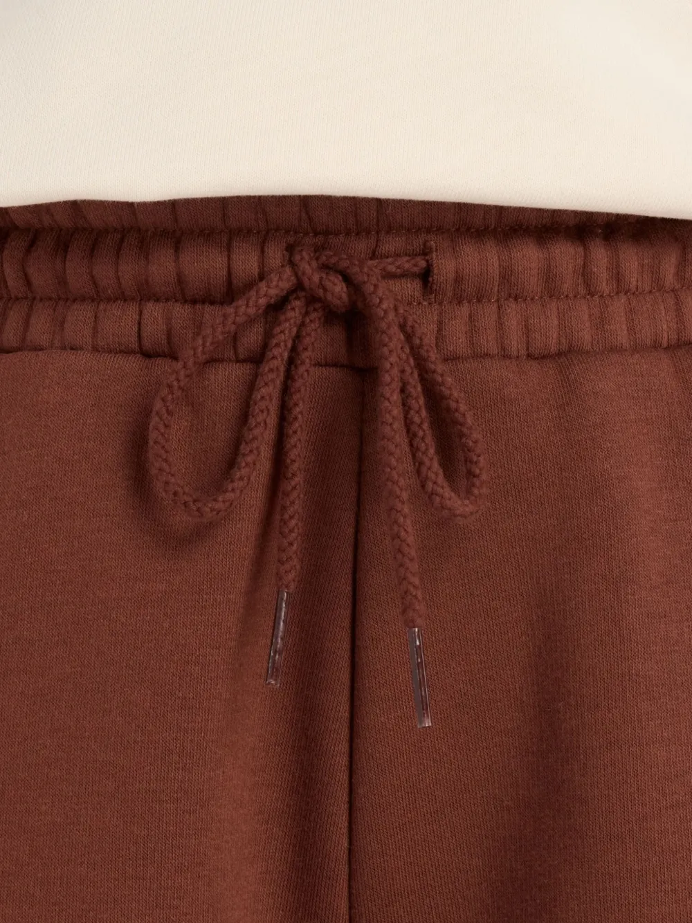 New Balance Broek met wijde pijpen en logodetail Bruin