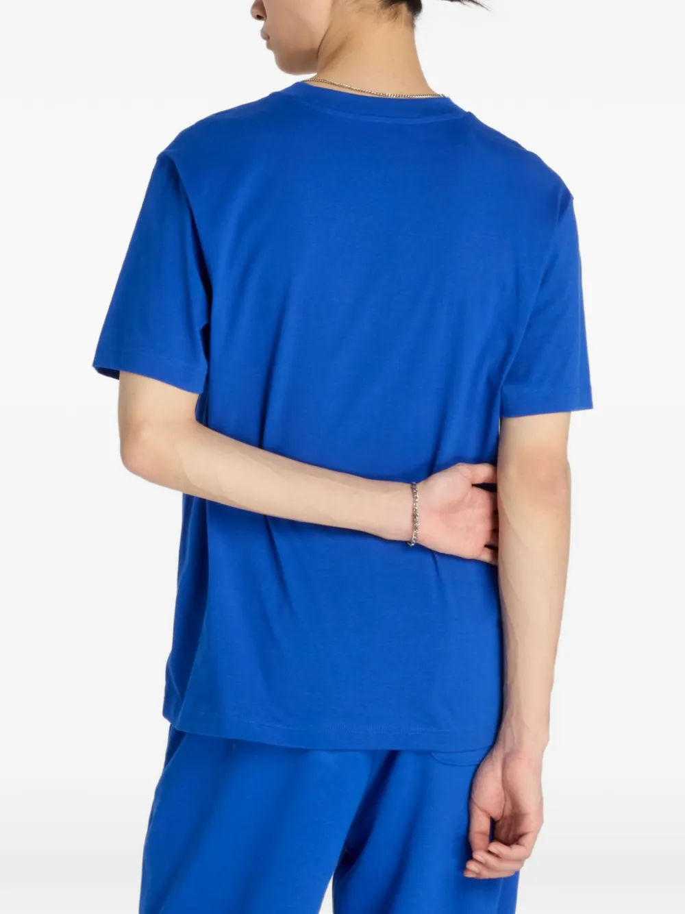 New Balance T-shirt met geborduurd logo Blauw