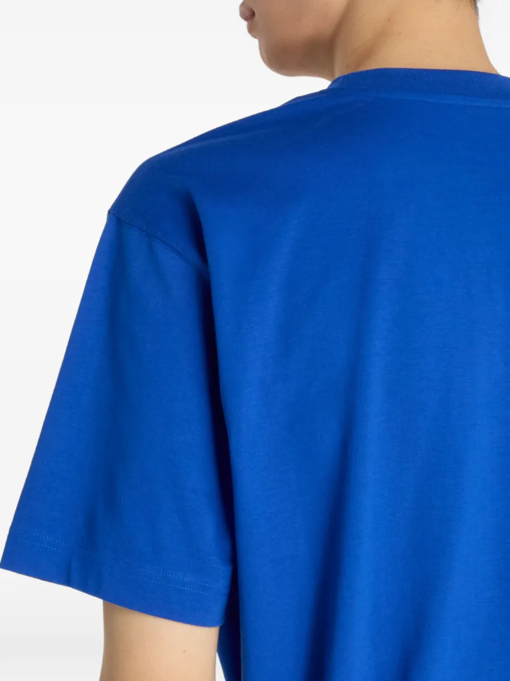 New Balance T-shirt met geborduurd logo Blauw