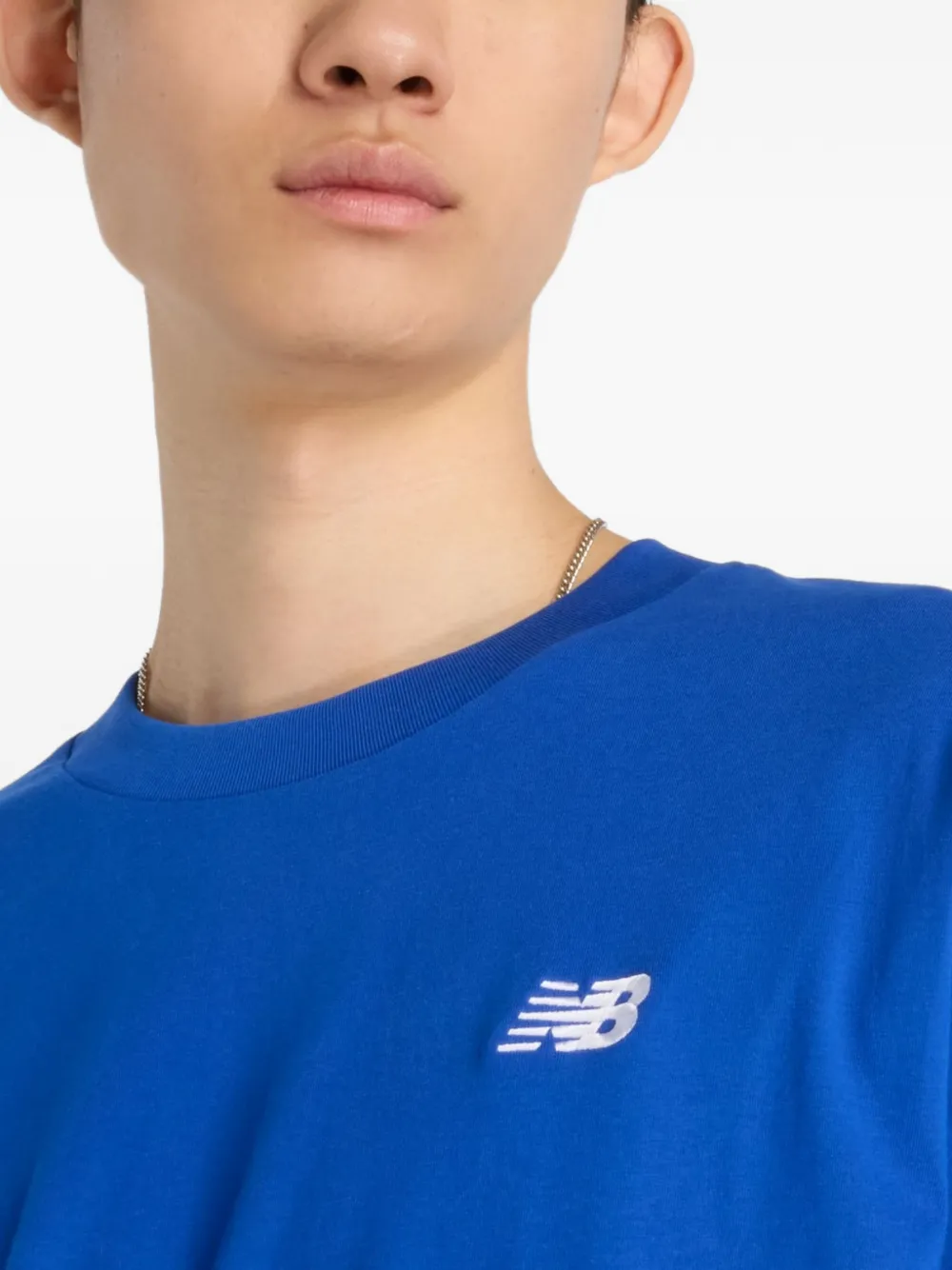 New Balance T-shirt met geborduurd logo Blauw