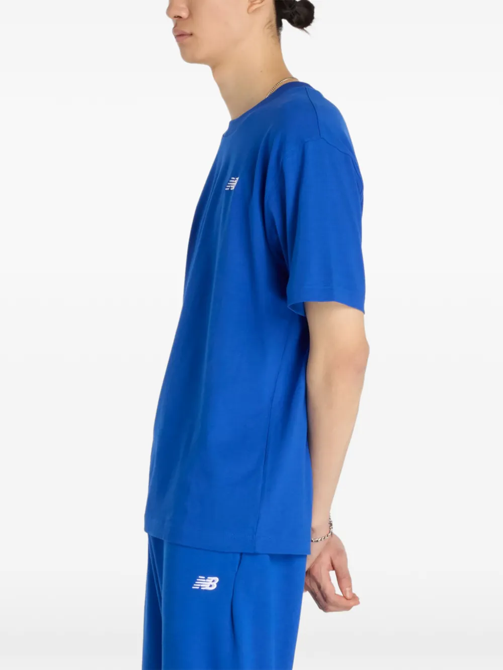 New Balance T-shirt met geborduurd logo Blauw