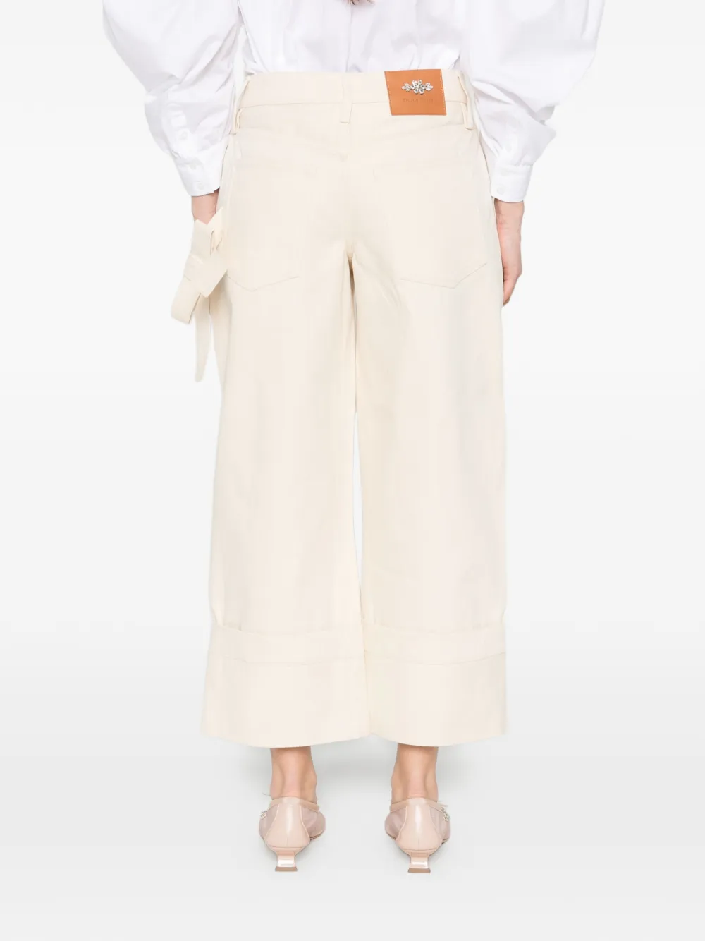 Simone Rocha Jeans met riemlussen Beige