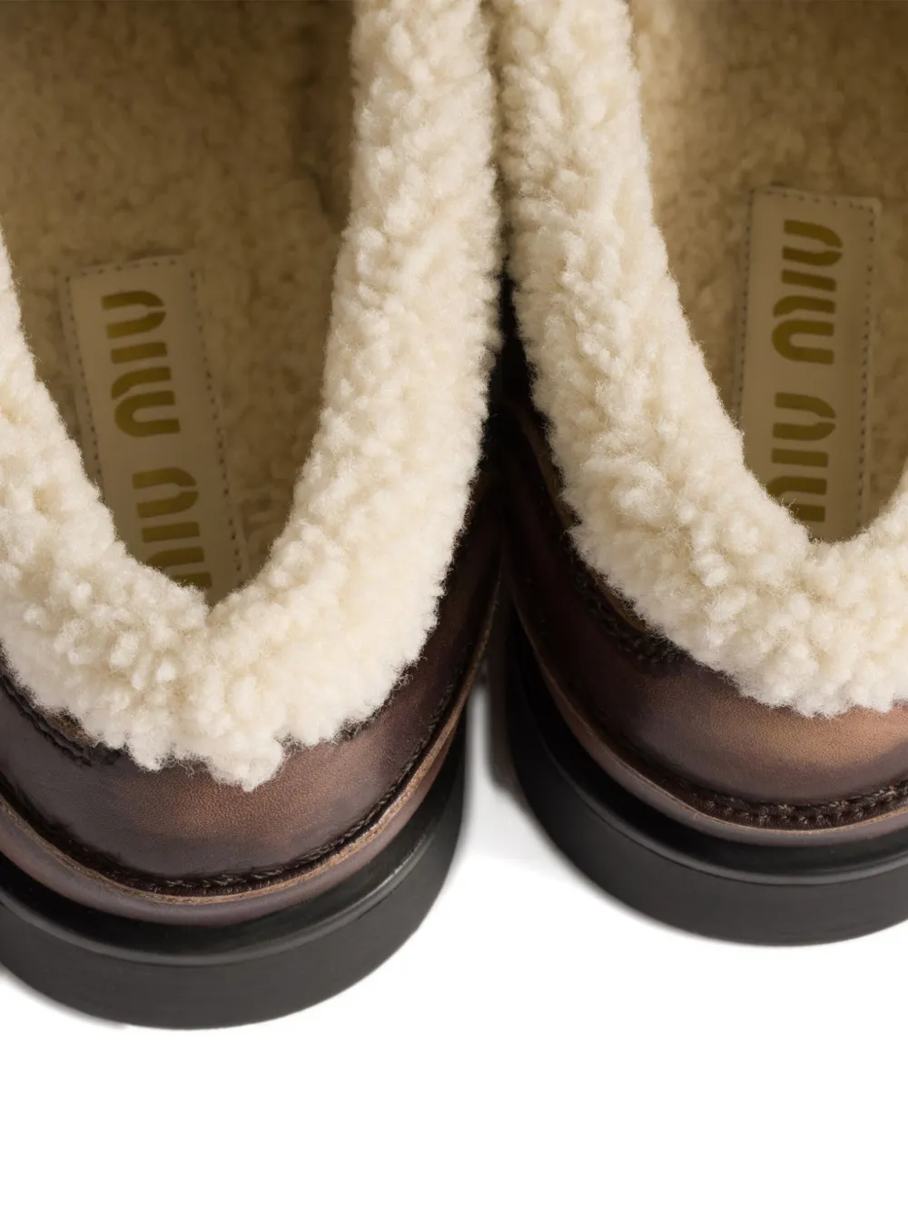 Miu Penny loafers met lammy voering Bruin