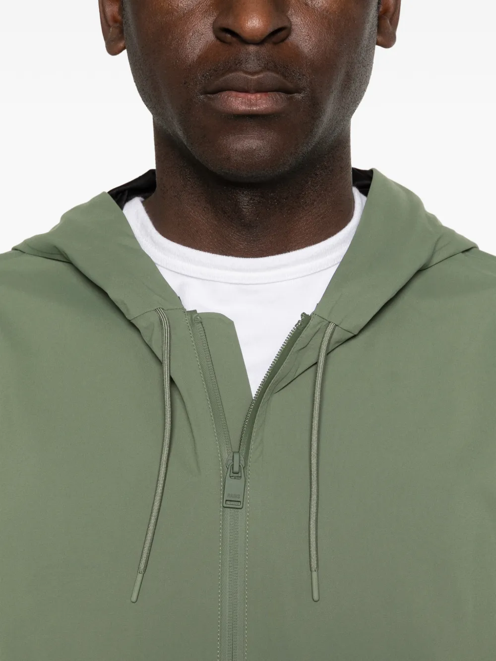 Rains Suva hardshell jack met capuchon Groen