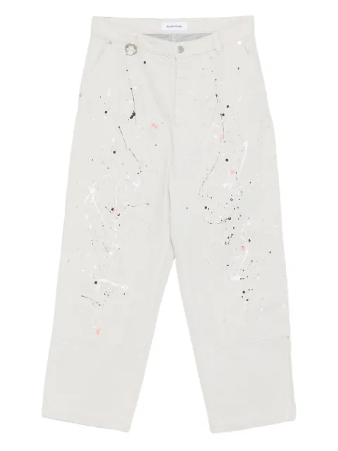 Études Studio jeans con estampado de salpicaduras de pintura