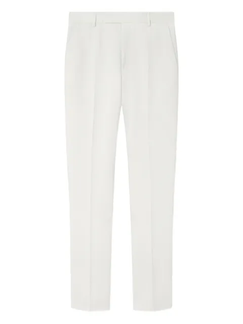 Versace logo-patch trousers