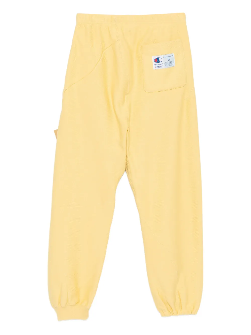 Undercover x Champion trainingsbroek met geborduurd logo - Geel