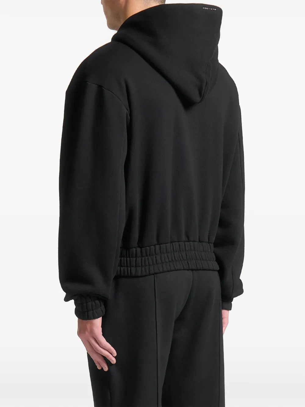 Manière De Voir Kevin embossed-logo zip-up hoodie Zwart