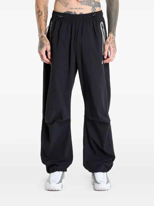 nike tech woven trousers